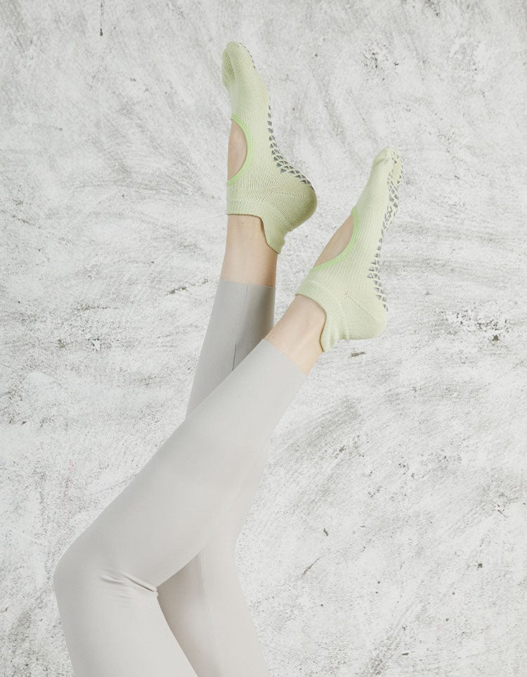 Barefoot style yoga socks with silicone grip bottom