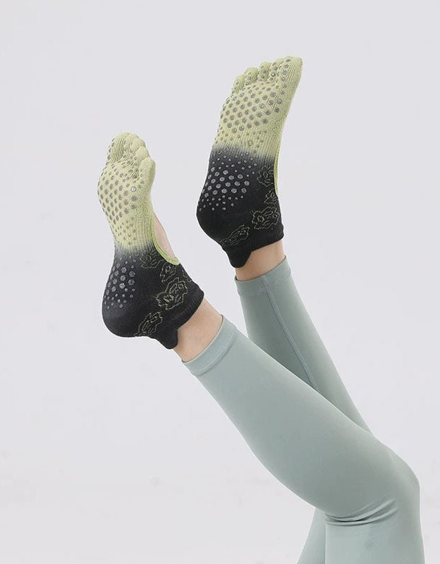 Women wearing five toe yoga grip socks non slip design