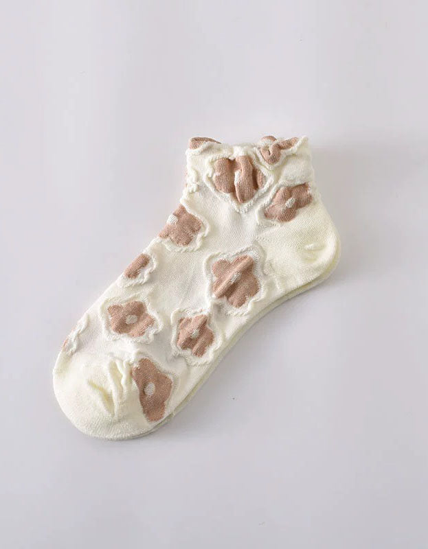 Women wearing floral sheer ankle socks styled with casual outfit
