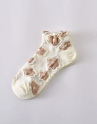 Women wearing floral sheer ankle socks styled with casual outfit