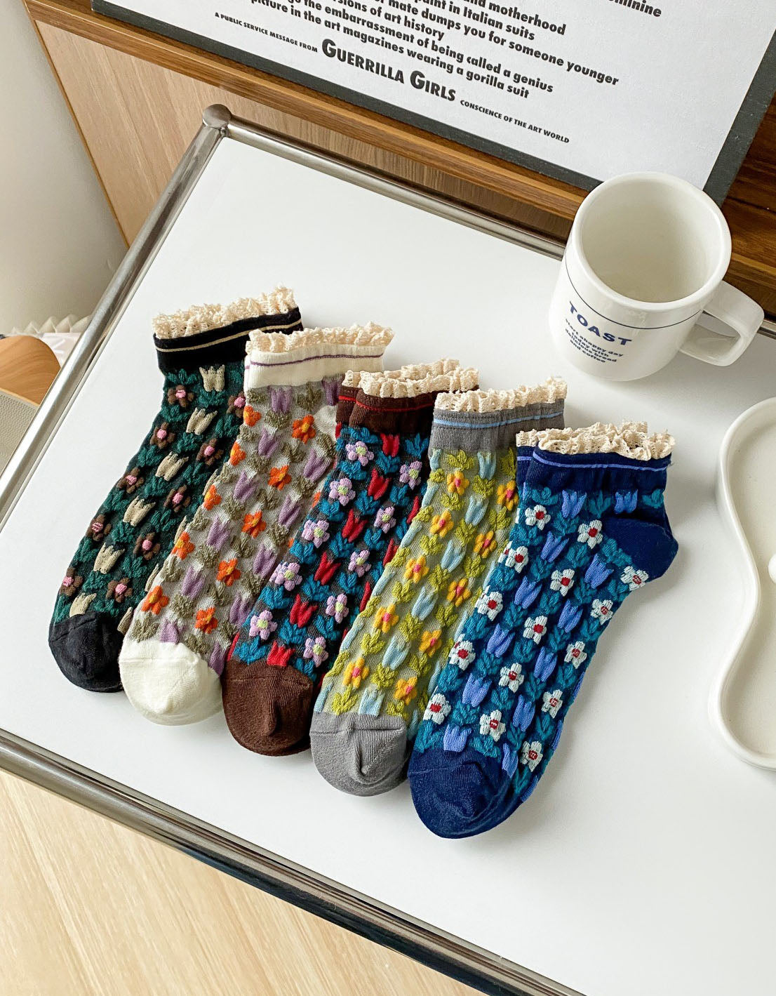 floral knit socks with lace trim displayed on table