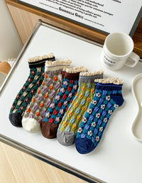 floral knit socks with lace trim displayed on table