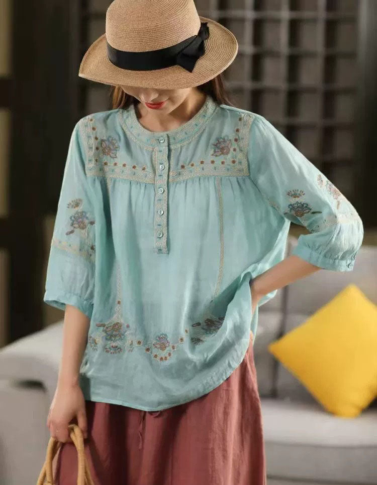 Women’s bohemian embroidered cotton blouse with button details and relaxed fit, perfect for casual wear