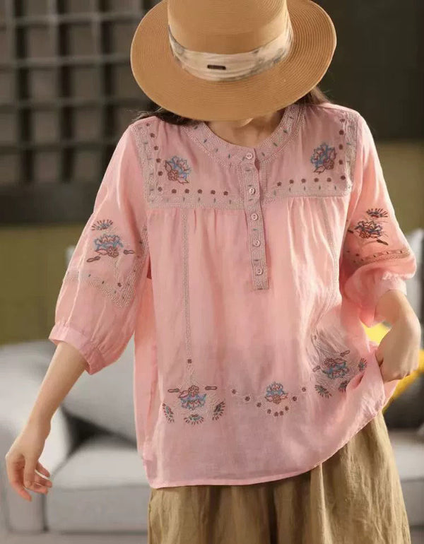 Pink bohemian-style women’s embroidered cotton blouse with button-up front and floral embroidery