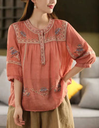 Women’s orange bohemian embroidered cotton blouse with button details and relaxed fit