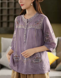 Side view of purple bohemian embroidered cotton blouse with vintage vibe