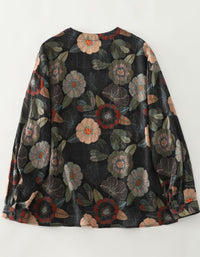 Back view of women’s black floral button down blouse with all‑over flower print