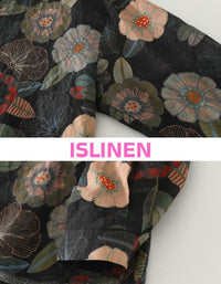 Close-up of woman wearing black floral V neck button blouse styled with light skirt for casual boho outfit