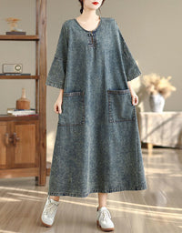 Side view of women’s denim maxi dress with loose fit and pockets