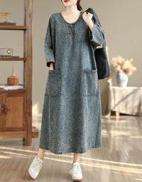 Front view of women’s denim maxi dress with loose fit and pockets