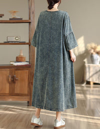 Back view of women’s denim maxi dress with relaxed fit and pockets