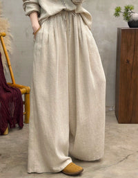Breathable women’s light beige linen pants with relaxed wide-leg fit, perfect for casual summer days and comfortable daily wear