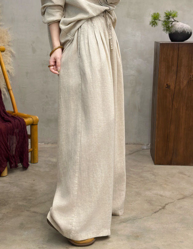 Side view of Women’s light beige linen pants with drawstring waist, wide-leg relaxed fit, breathable casual trousers for everyday wear