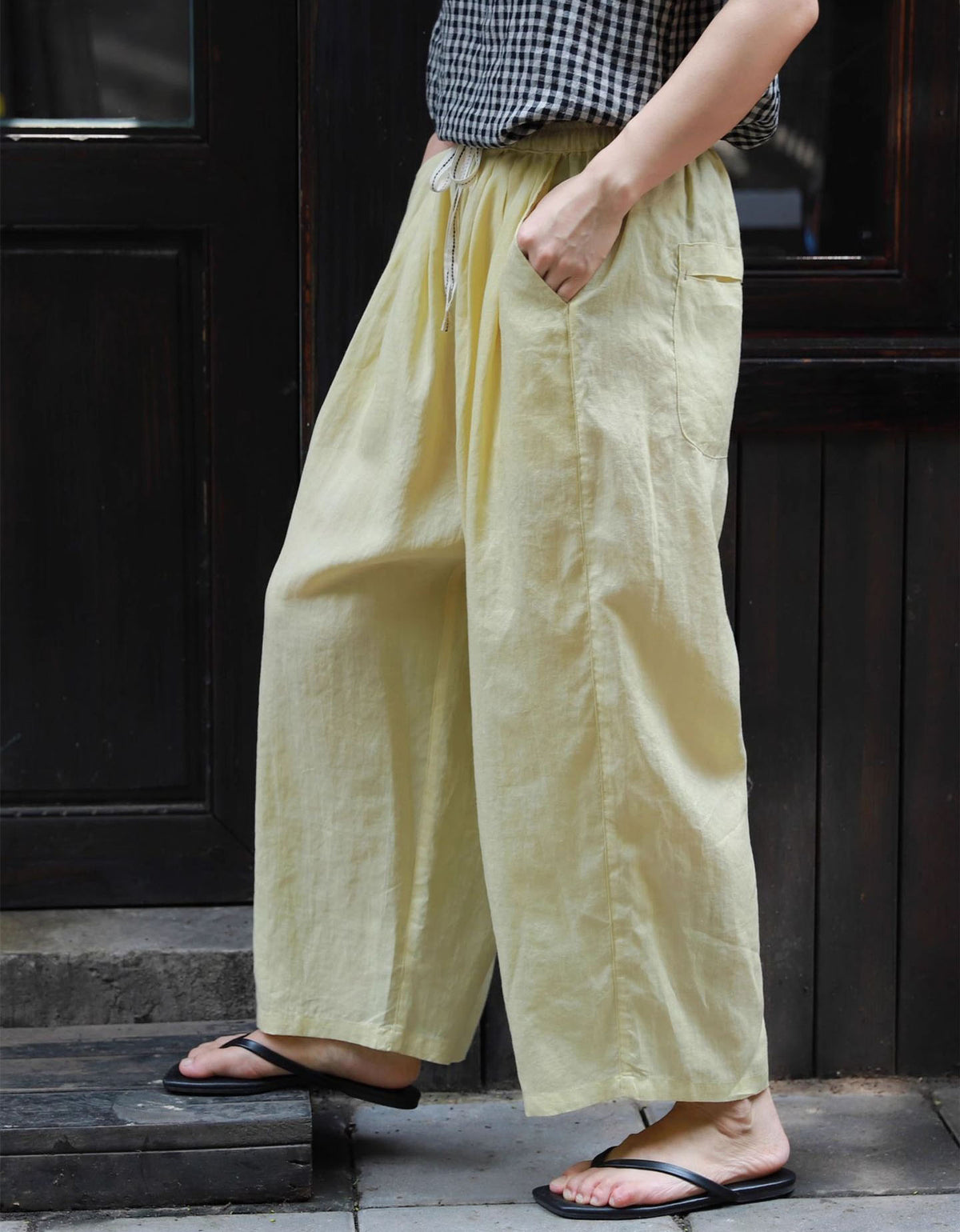 Women styling breathable wide-leg cotton linen pants for casual summer look