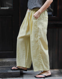 Women styling breathable wide-leg cotton linen pants for casual summer look