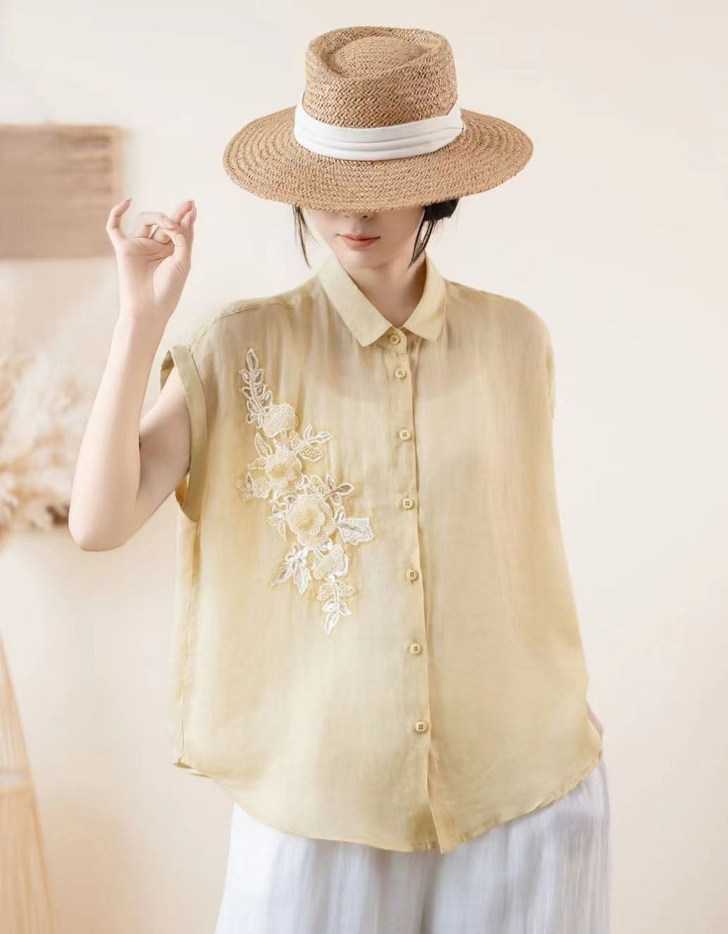 Women’s embroidered sleeveless linen blouse button down front view