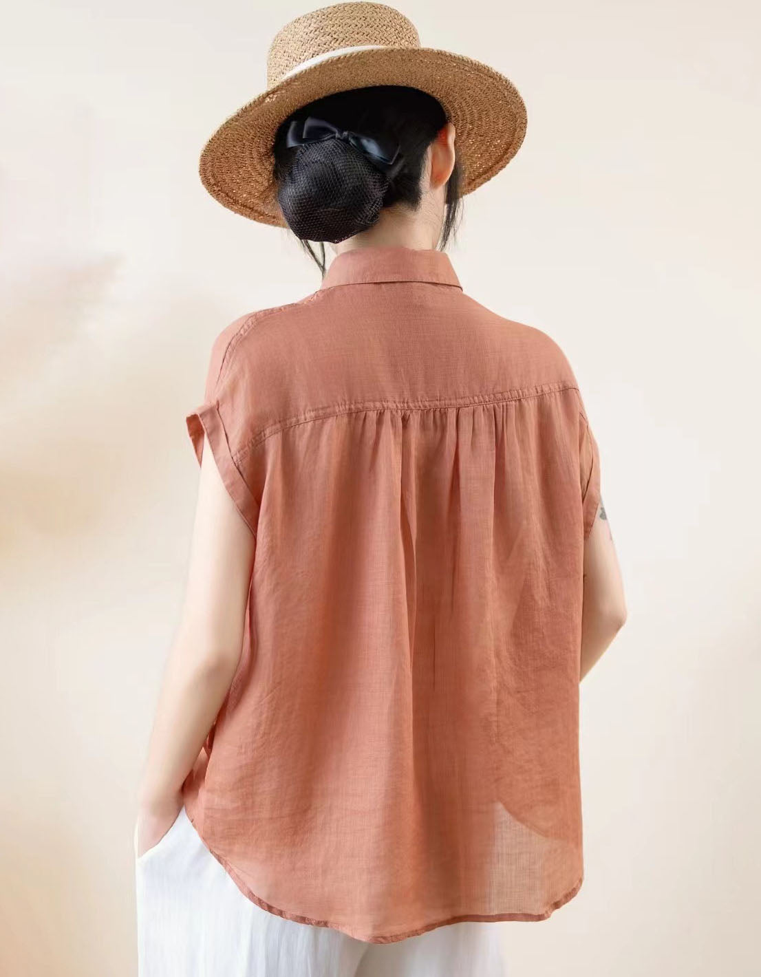 Button down sleeveless blouse side view relaxed fit