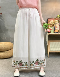 High waist embroidered wide leg linen trousers with boho floral border design.
