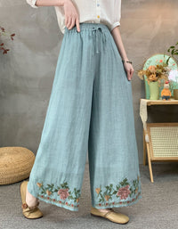 High waist light blue embroidered wide leg linen trousers with boho floral border design side view