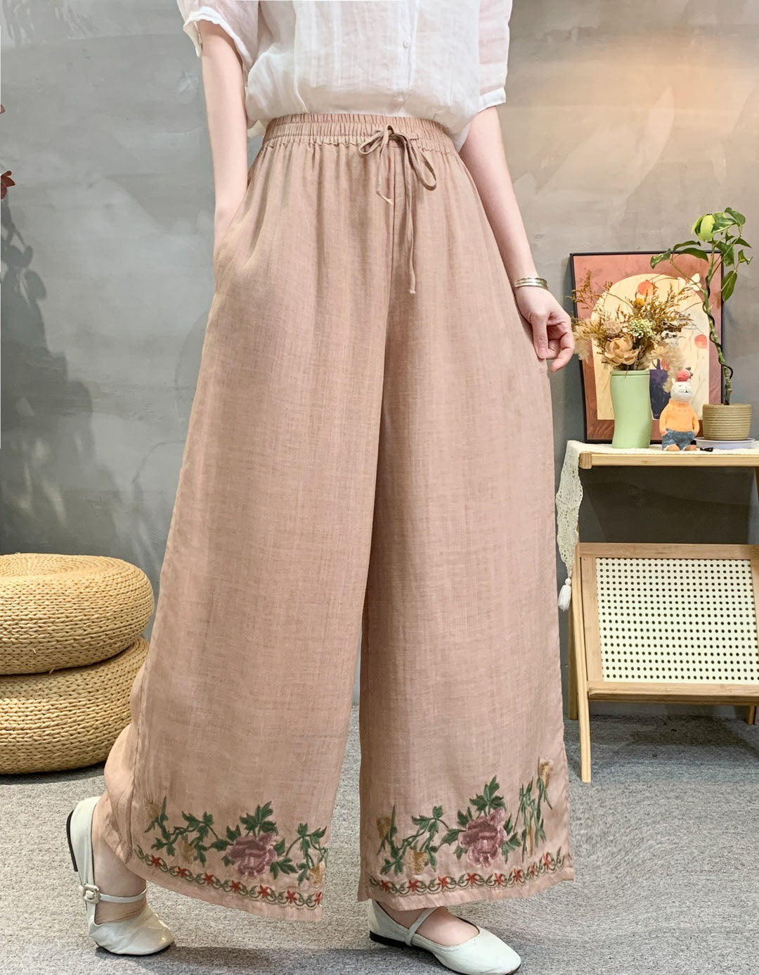High waist light orange embroidered wide leg linen trousers with boho floral border design.