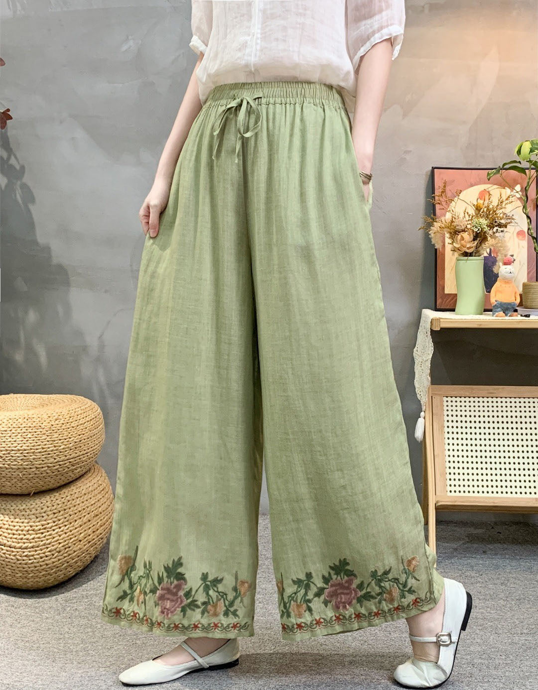 High waist green embroidered wide leg linen trousers with boho floral border design.