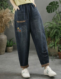 Vintage-style women’s casual denim pants with button accents side view