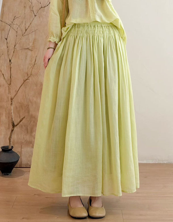 Women wearing lime green flowy linen maxi skirt with elastic smocked waist