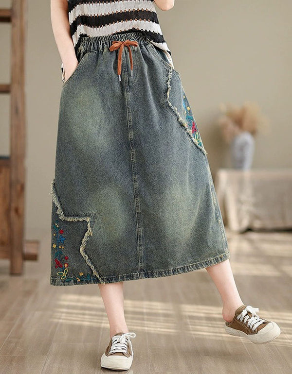 Loose fit vintage jean skirt with embroidered patchwork design