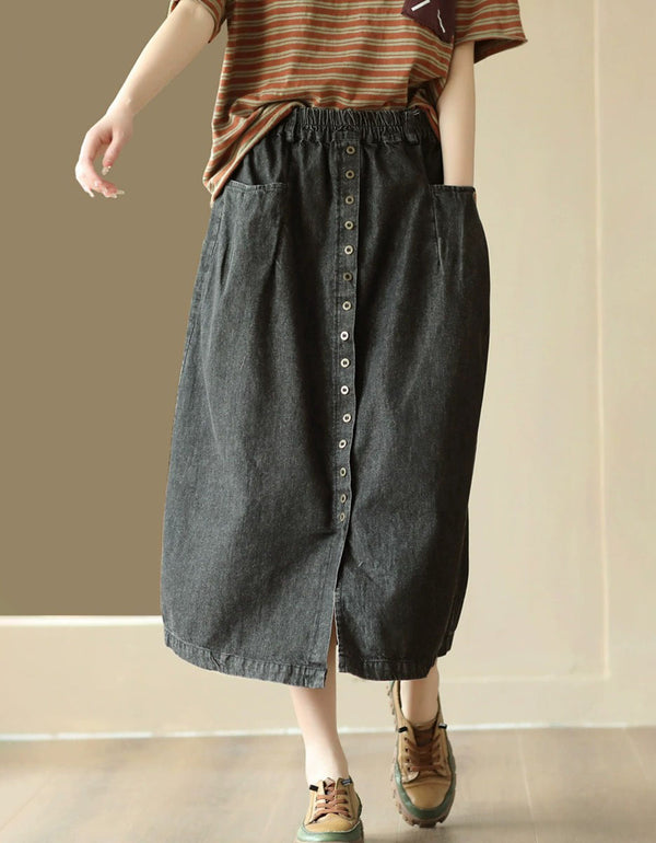 Front view of women’s loose fit denim midi skirt with buttons