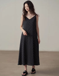 Women wearing black polka dot midi dress sleeveless