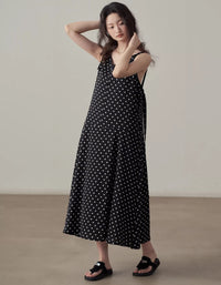 Casual black midi dress with white polka dots front view