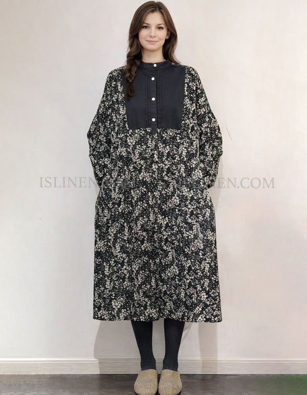 Colorblock long sleeve midi dress with black yoke panel and grey mini‑check body, front view on model with tights and slippers.