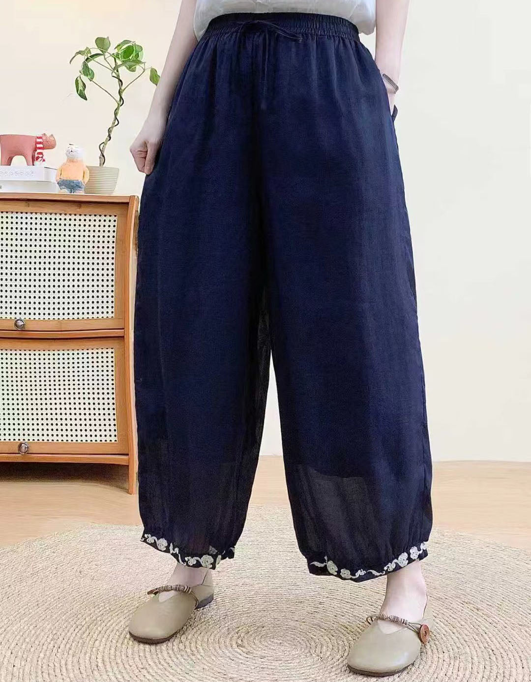 Soft lightweight linen harem trousers paired with casual flat shoes