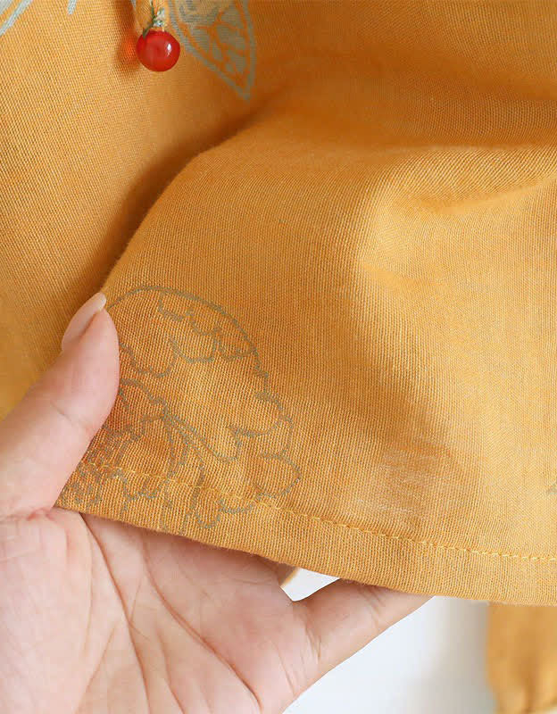 Close-up of the lightweight and soft cotton material of the floral embroidered top, perfect for casual wear and warm weathe