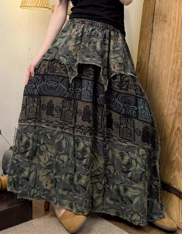 Person wearing a long, patterned skirt in a home setting.