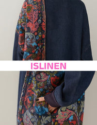 Close up view of loose fit denim tunic sweater with floral print panel