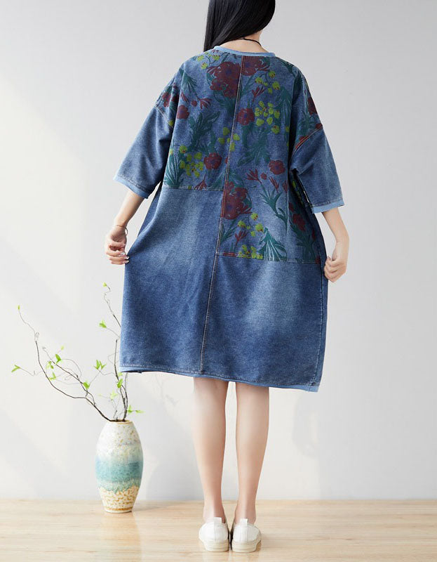 Back view of women’s floral denim dress showcasing pockets