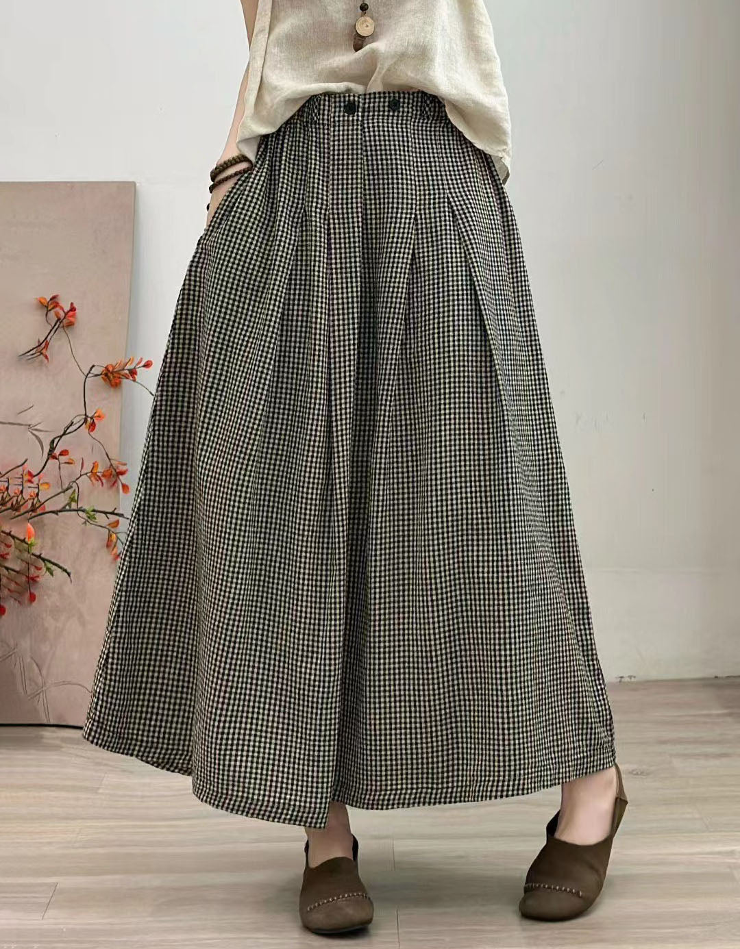 Plaid pleated midi skirt with high waist and loose fit design for women