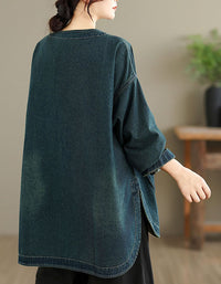 Back view of women’s relaxed fit denim top with long sleeves