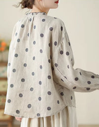 Casual and comfortable women’s polka dot blouse with a round neckline back view