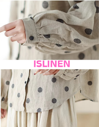 Close-up of loose fit linen shirt with polka dots and cuffed sleeves