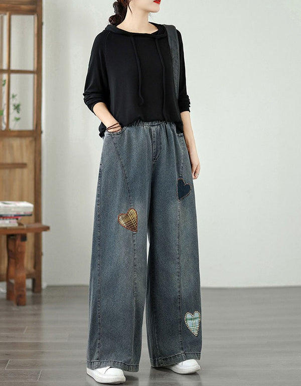 Front view of women’s wide-leg jeans with decorative heart patches