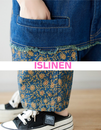 Denim overall jumpsuit patchwork detail close up