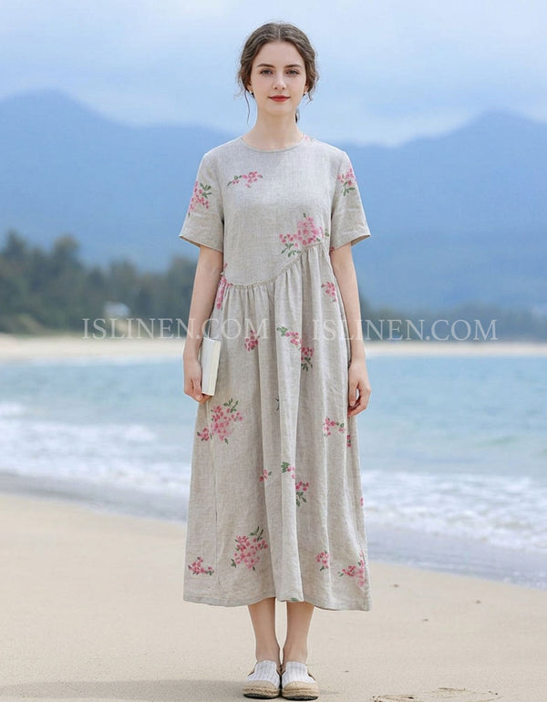 Woman wearing floral linen midi dress on beach, loose casual summer dress