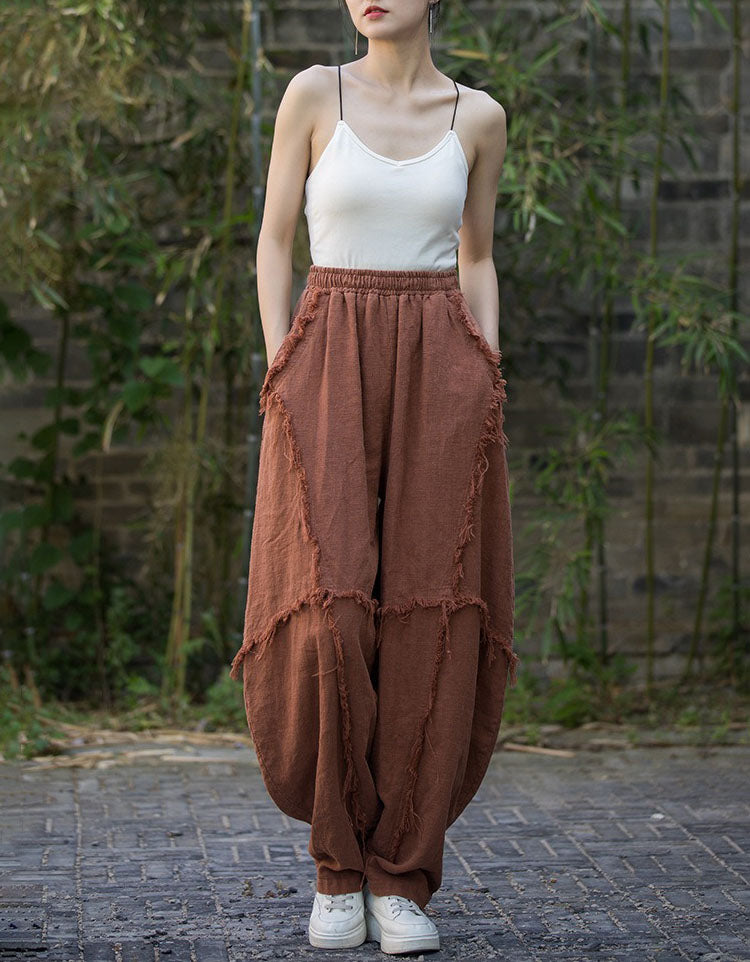 Front view of women’s loose fit linen harem pants brick red