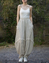 Front view of women’s loose fit linen harem pants beige 