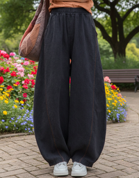 Women’s black loose harem pants elastic waist front view