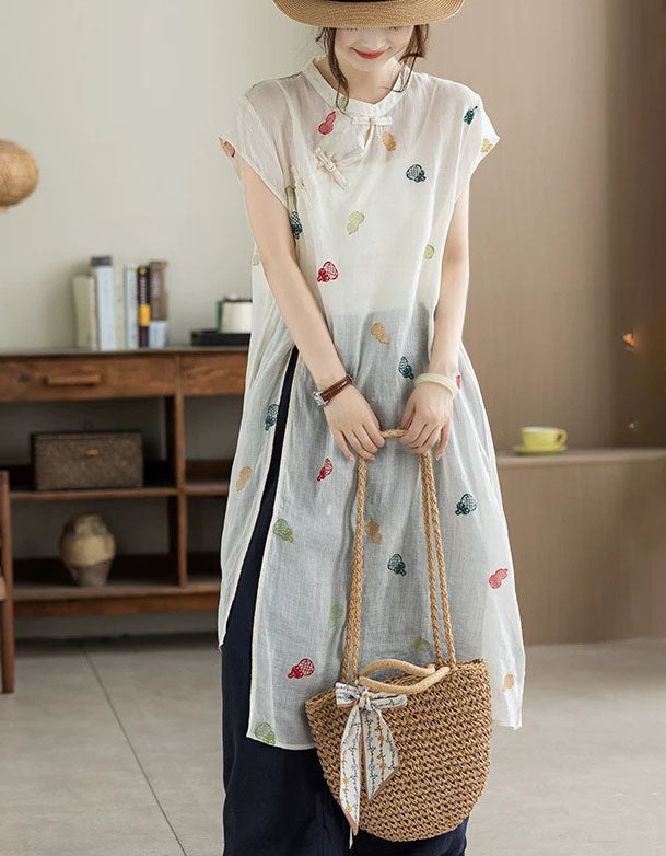 Front view of apricot embroidered loose fit linen midi dress for women