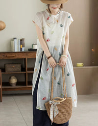 Front view of apricot embroidered loose fit linen midi dress for women