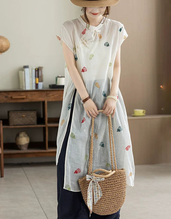 Front view of apricot embroidered loose fit linen midi dress for women